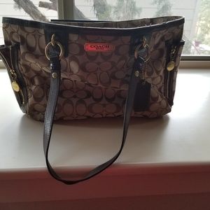 Brown and tan Coach handbag.